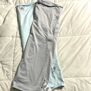 2 Ollie World sleep sacks in stone and sky with laundry bags